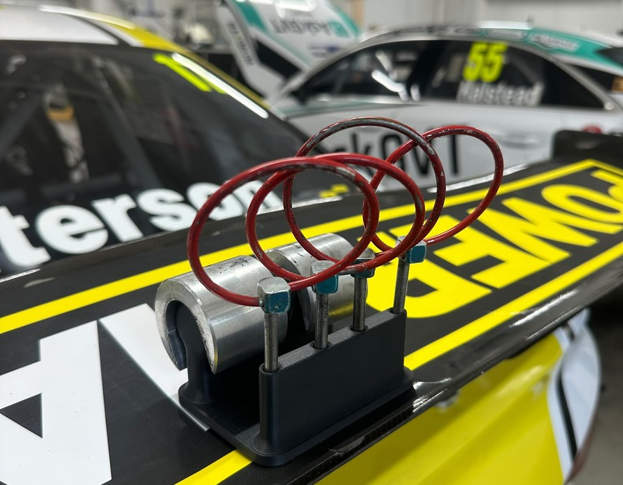 Bespoke 3D printed motorsport component in use on a touring car
