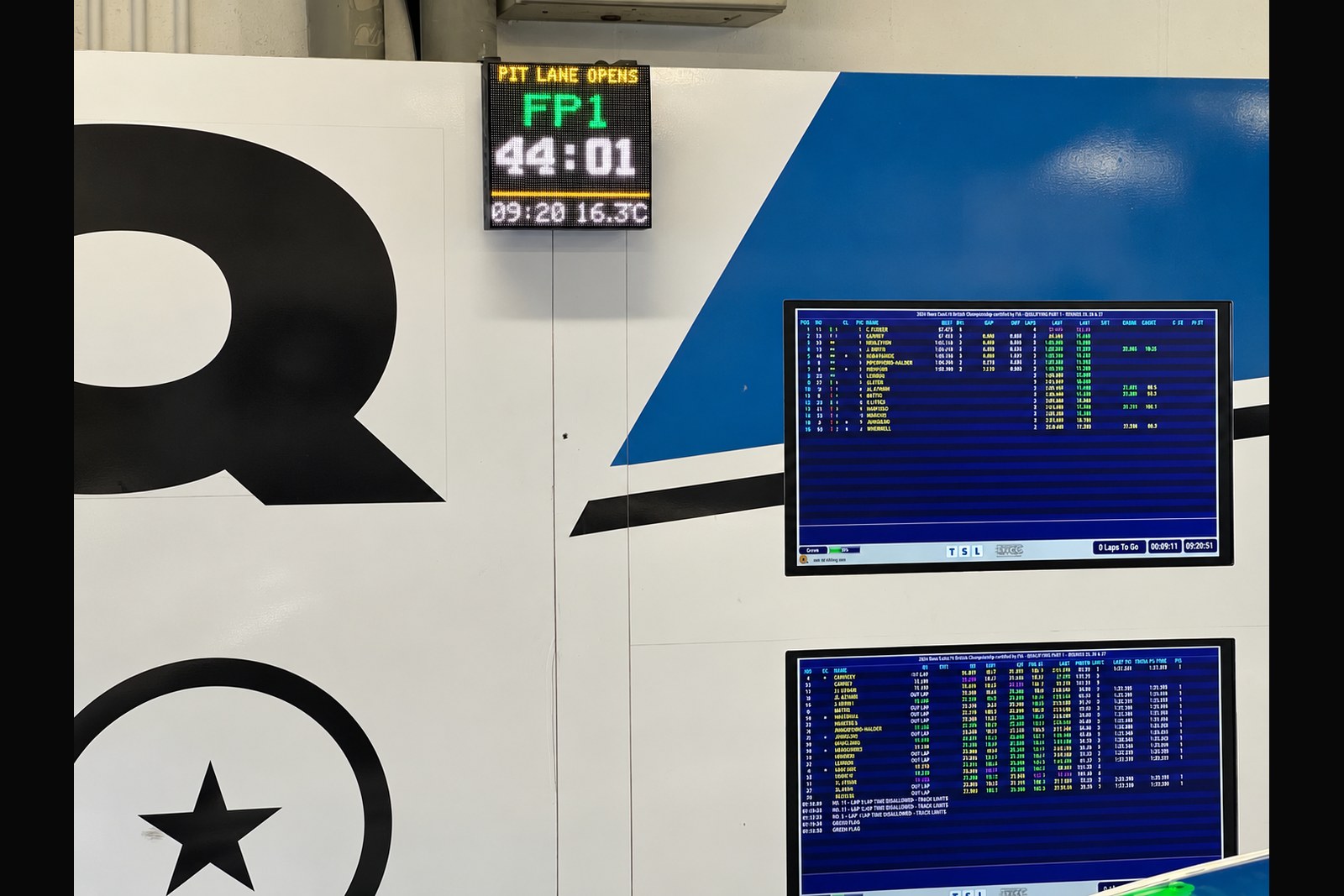 PitClock Pro timing displays operating in a professional touring car garage